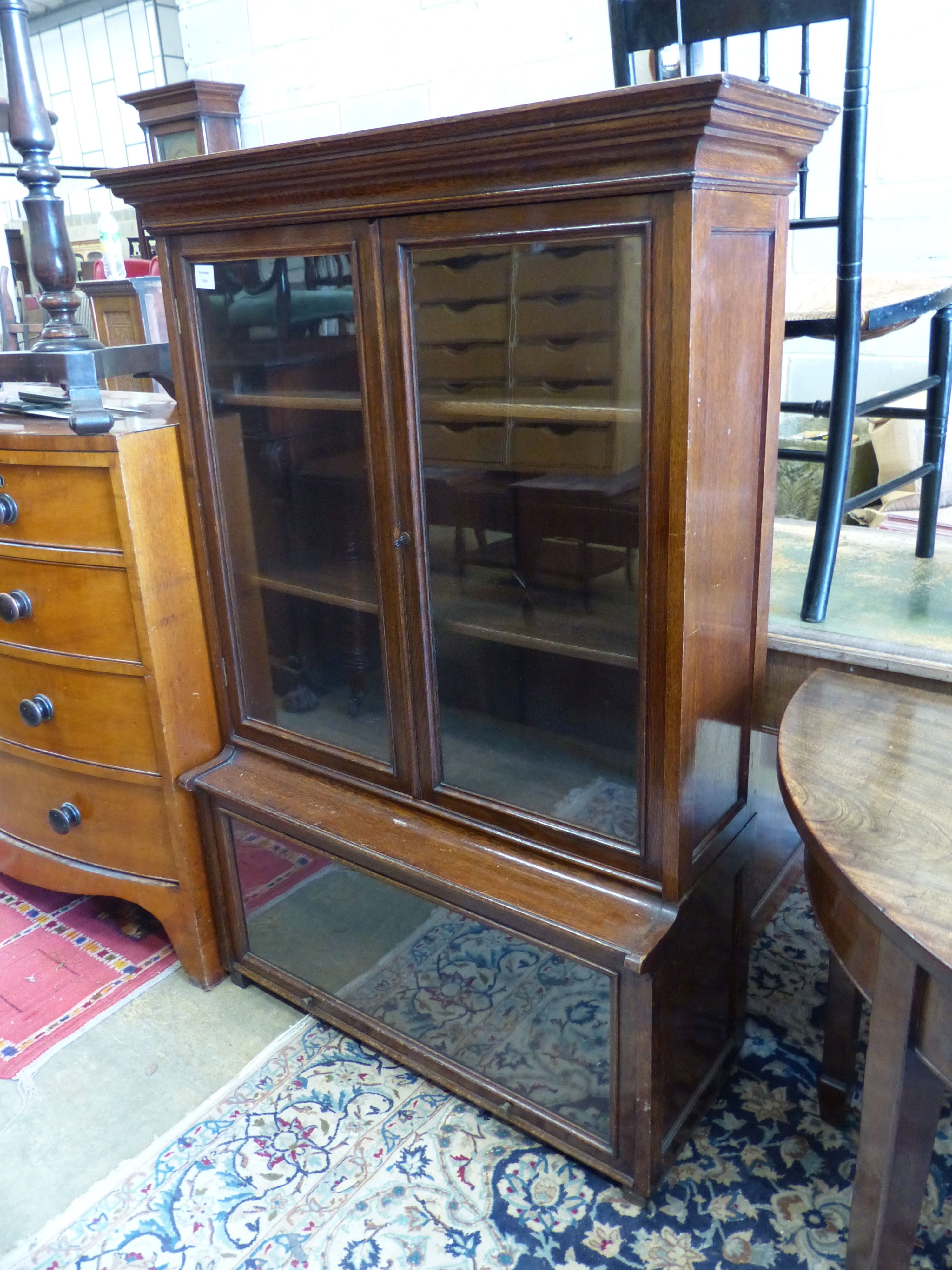A 1920's standard oak bookcase, length 97cm, depth 37cm, height 138cm